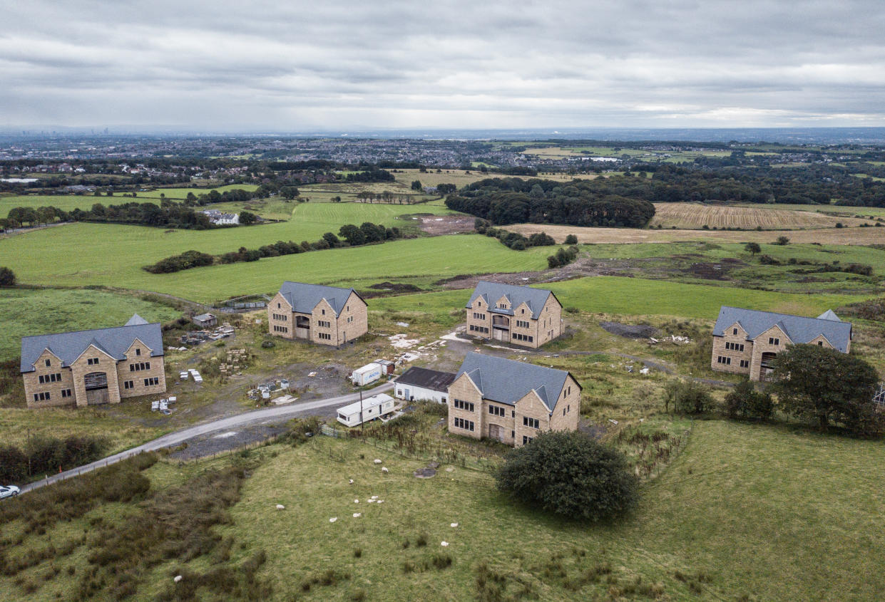 Drone images of mansions under threat of demolition, Bolton, Lancs. See SWNS story SWLEhouses; The owners of five luxury mansions which were built too big and in the wrong place face the threat of having their million-pound homes demolished. Residents wanted to broker a deal with a local council after it was found the properties were not built in accordance with planning permission. It had been hoped council chiefs would wave through the latest application after it was recommended for approval by town planners. But the revised plans, which involved knocking down and rebuilding two properties and reducing the size of another at a cost of more than Â£1m, was last week thrown out by councillors.