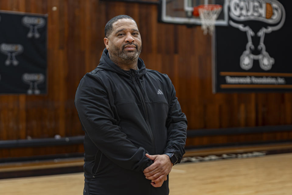 Book Richardson, director of the New York Gauchos boy's basketball program, poses for a portrait at the Gaucho Gym, Monday, March 11, 2024, in the Bronx borough of New York. Four assistant coaches arrested in a 2017 FBI probe designed to clean up college basketball are Black. All are out of the sport, banned by the NCAA. One coach, Book Richardson, tells The Associated Press he knows why: Because Black assistants were the low-hanging fruit — the ones on the front lines making connections with athletes who go on to play in college.(AP Photo/Peter K. Afriyie)