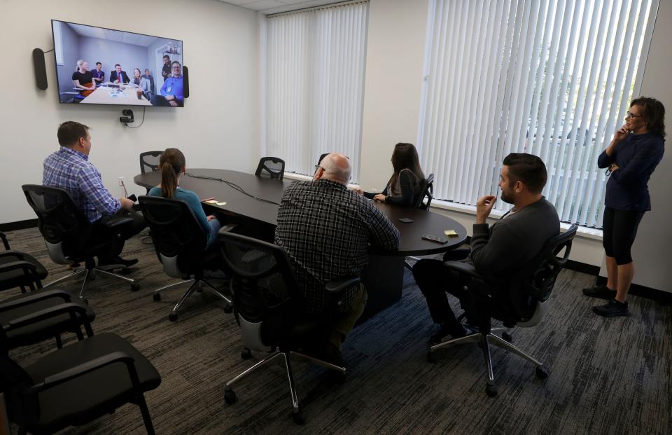 A NewsNet story and budget meeting is conducted between its Cadillac office, on the TV, and the Farmington Hills office on Oct. 4, 2022. Manoj Bhargava, the founder and owner of 5-Hour Energy brand, has been making a push into the TV market.