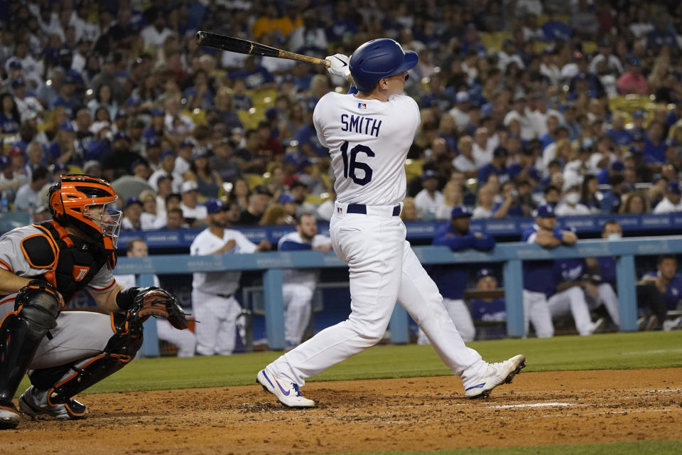 Los Angeles Dodgers' Will Smith follows through on his two-run home run during the fourth inning of the team's baseball game against the San Francisco Giants on Thursday, July 22, 2021, in Los Angeles. (AP Photo/Marcio Jose Sanchez)