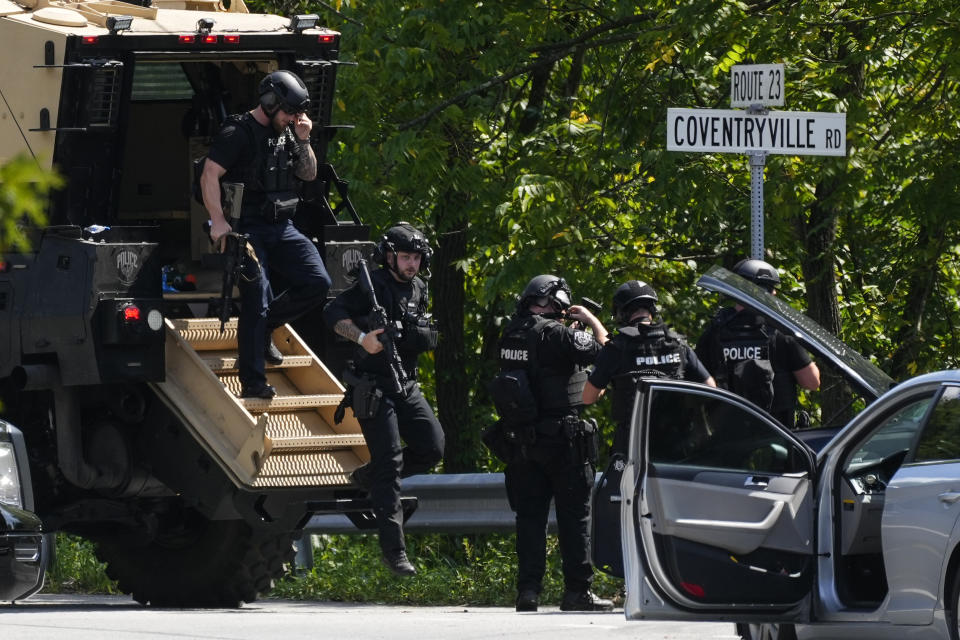 Law enforcement officers gather as the search for escaped convict Danelo Cavalcante continues Tuesday, Sept. 12, 2023, in Pottstown, Pa. (AP Photo/Matt Rourke)