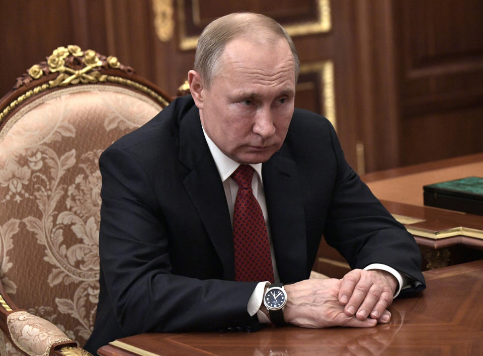 Russian President Vladimir Putin listens to Tax Service chief Mikhail Mishustin during their meetingin the Kremlin in Moscow, Russia, Wednesday, Jan. 15, 2020. Putin has named Tax Service chief Mikhail Mishustin as Russia's new prime minister. The 53-year-old Mishustin has worked in the government since 1998. Mishustin has a kept low profile while serving as the head of the Federal Tax Service since 2010. (Alexei Nikolsky, Sputnik, Kremlin Pool Photo via AP)