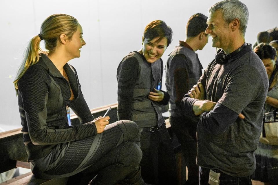 This photo released by Summit Entertainment shows, from left, actress Shailene Woodley, author Veronica Roth, and director Neil Burger on the set of the film, "Divergent." The movie releases on Friday, March 21, 2014. (AP Photo/Summit Entertainment, Jaap Buitendijk)