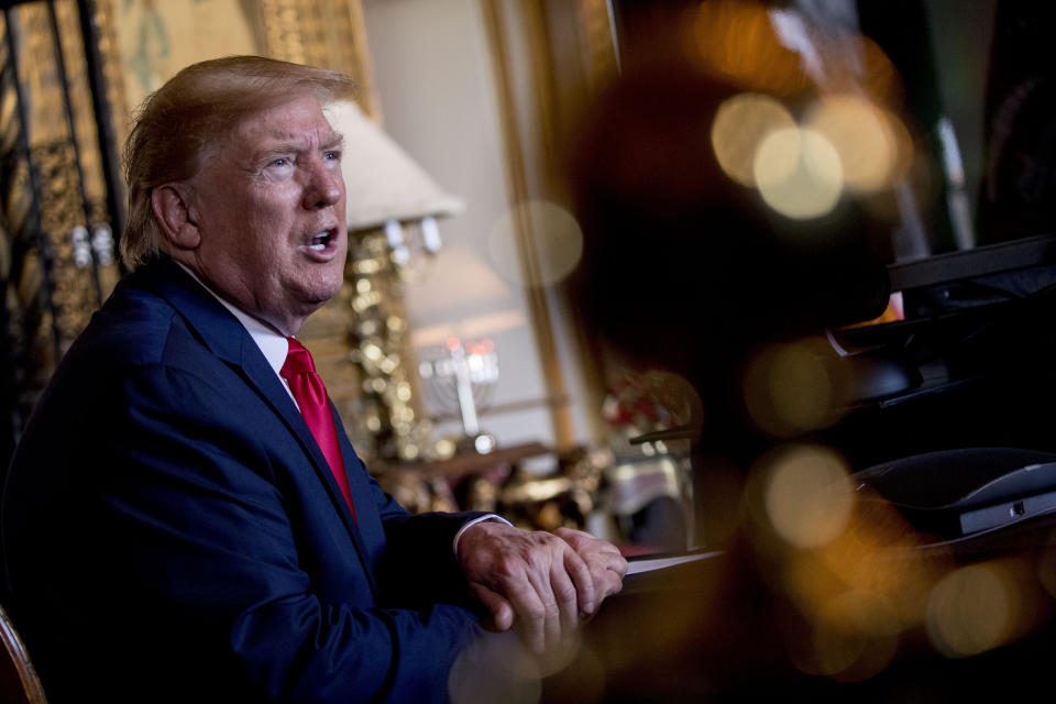 President Donald Trump speaks to members of the media following a Christmas Eve video teleconference with members of the military at his Mar-a-Lago estate in Palm Beach, Fla., Tuesday, Dec. 24, 2019. (AP Photo/Andrew Harnik)