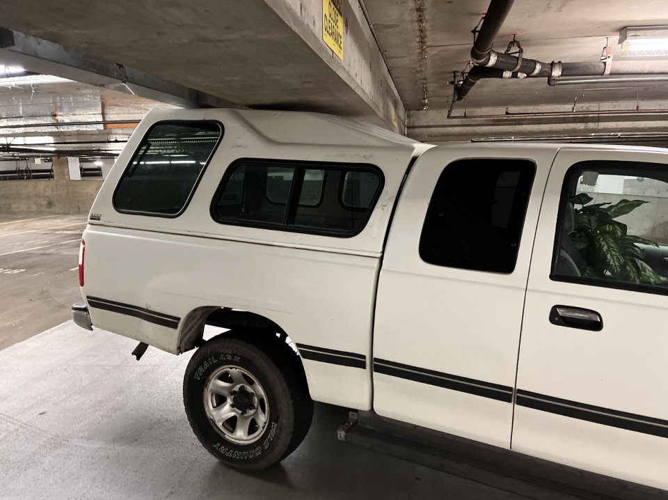 the back of the truck going under the concrete beam in the garage