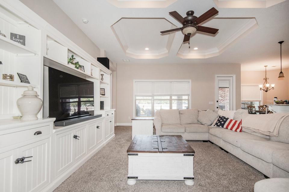 The family room is brimming with natural light and overlooks the patio.