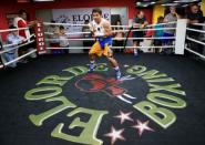 Senator and boxing champion Manny "Pacman" Pacquiao shadow boxes during his training inside the Elorde gym in Pasay city, metro Manila, Philippines September 28, 2016 in preparation for his upcoming bout with Jessie Vargas next month in Las Vegas, U.S.A. Picture taken September 28, 2016. REUTERS/Romeo Ranoco