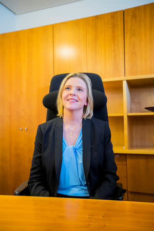 Sylvi Listhaug sits at the desk after she was introduced as the new Senior and Public Health Minister, in Oslo, Norway May 3, 2019. NTB scanpix/Stian Lysberg Solum via REUTERS