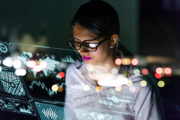 A woman views cloud-based data.