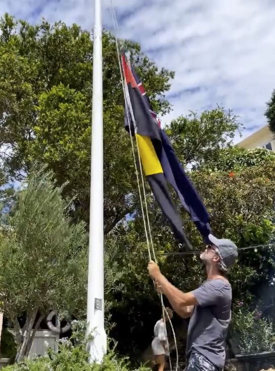 In one video, you can see the Aboriginal flag is flying upside down. Photo: Instagram/Pip Edwards