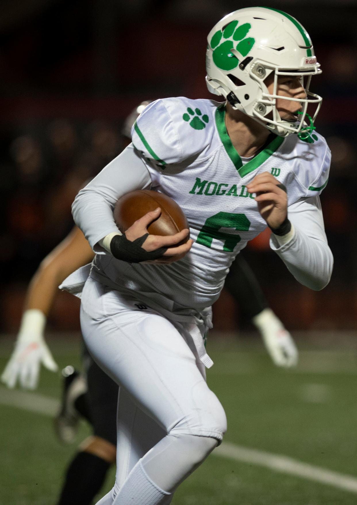 Salem, Ohio. Division VI Regional Finals, Springfield, 43, Mogadore, 27. William Butler with possession.