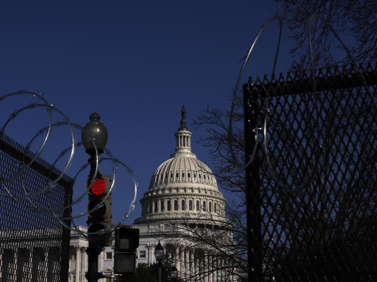 <p>WASHINGTON, DC - MARCH 04: Razor wire is attached to the top of temporary fencing as the U.S. Capitol is seen in the background on March 4, 2021 on Capitol Hill in Washington, DC.  </p> ((Photo by Alex Wong/Getty Images))