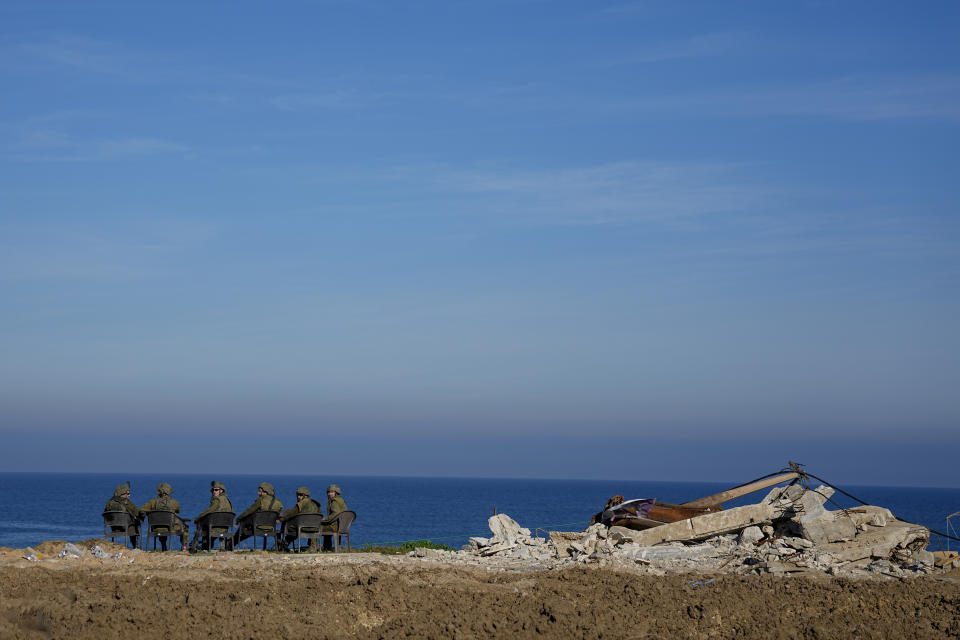 Israeli soldiers watch the Mediterranean Sea during a ground operation in Gaza, Thursday, Feb. 8, 2024. The Israeli military says it has discovered tunnels underneath the main headquarters of the U.N. agency for Palestinian refugees in Gaza City, alleging that Hamas militants used the space as an electrical supply room. The unveiling of the tunnels marked the latest chapter in Israel's campaign against the embattled agency, which it accuses of collaborating with Hamas. (AP Photo/Ariel Schalit)