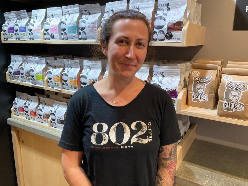 Capitol Grounds Cafe owner Julia Watson stands at the Montpelier shop Dec. 15, 2023.
