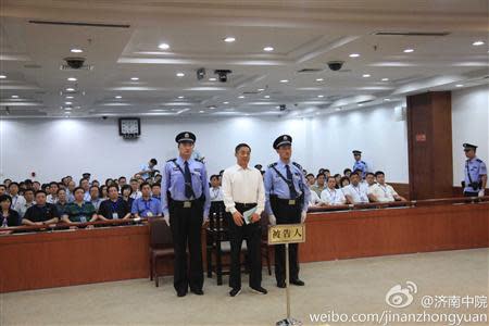Ousted Chinese politician Bo Xilai (C) listens to his verdict inside the court in Jinan, Shandong province September 22, 2013, in this photo released by Jinan Intermediate People's Court. REUTERS/Jinan Intermediate People's Court/Handout via Reuters