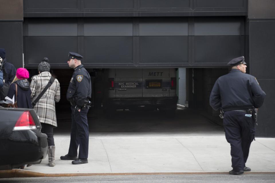 A medical examiners truck is parked inside a garage at a building where the body of fashion designer L'Wren Scott was found, Monday, March 17, 2014, in New York. Scott, who was Mick Jagger's girlfriend, was found dead of a possible suicide, a law enforcement official said Monday. (AP Photo/John Minchillo)