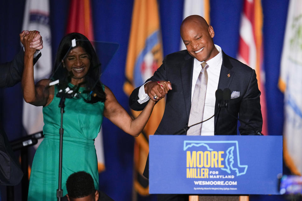 Democrats Aruna Miller, left, and Wes Moore react during an election night gathering after Miller was declared the winner in the race for the Maryland lieutenant governor and Moore was declared the winner in the gubernatorial race, Tuesday, Nov. 8, 2022, in Baltimore. (AP Photo/Julio Cortez)