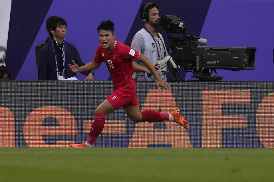 Vietnam's Pham Tuan Hai celebrates after scoring his side's second goal during the Asian Cup Group D soccer match between Japan and Vietnam at Al Thumama Stadium in Doha, Qatar, Sunday, Jan. 14, 2024. (AP Photo/Thanassis Stavrakis)