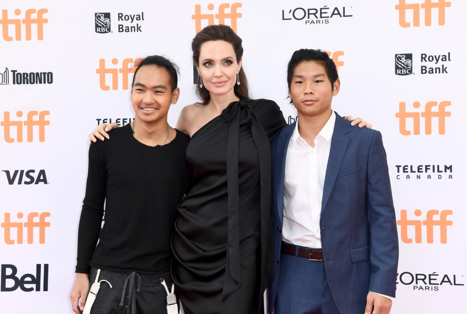 Angelina Jolie pictured with sons Maddox (L) and Pax (R) in 2017. Photo: Getty