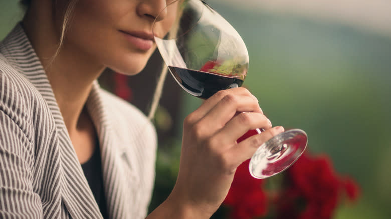 Woman sniffing wine