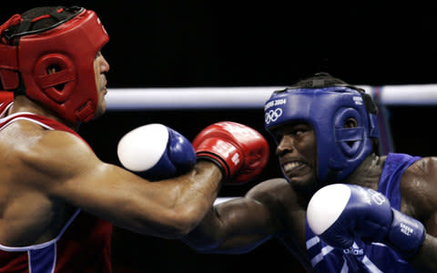 Carlos Takam (right) fighting for Cameroon - Credit: AP