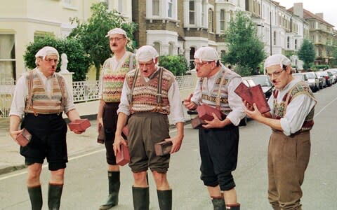 Terry Jones, John Cleese, Michael Palin, Terry Gilliam and Eddie Izzard dressed as Gumbies for a sketch for 'Python Night' in 1999 - Credit: PA