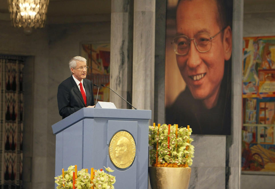 FILE - Chairman of the Norwegian Nobel Committee Thorbjoern Jagland speaks during the ceremony in Oslo City Hall, Friday Dec. 10, 2010 to honour this years Nobel Peace Prize winner, jailed Chinese dissident Liu Xiaobo, whose picture hangs behind. When imprisoned Chinese dissident Liu Xiaobo won the peace prize in 2010, Beijing responded by freezing trade talks with Norway. It took years for Norway-China relations to be restored. (Heiko Junge/Pool Photo via AP, File)