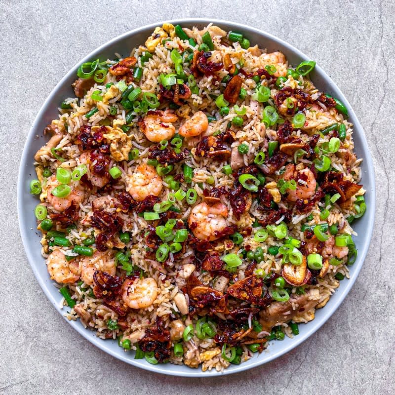 <p>Cookly Bookly</p><p>Ditch the takeaway and whip up this tasty fried rice with chicken, prawns, eggs, veggies and homemade chilli crisp.</p><p><strong>Get the recipe here: <a href="https://cooklybookly.com/recipes/e5c8cdbc-6a10-11eb-8227-c3eef0c1ff6a" rel="nofollow noopener" target="_blank" data-ylk="slk:Chili Crisp Fried Rice;elm:context_link;itc:0;sec:content-canvas" class="link ">Chili Crisp Fried Rice</a></strong></p>