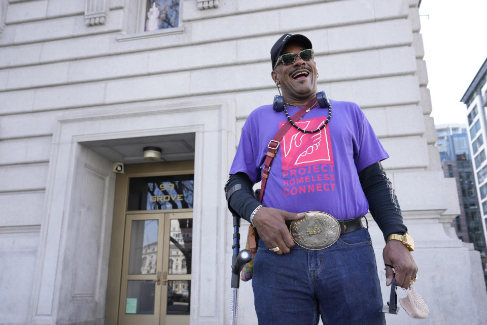Troy Brunet poses for photos in San Francisco, Wednesday, April 5, 2023. For 16 years, Brunet has volunteered with Project Homeless Connect in San Francisco and leads their initiative to give eyeglasses to those who need them. (AP Photo/Eric Risberg)