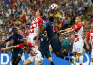 Croatia's Mario Mandzukic scores an own goal and the first goal for France. REUTERS/Kai Pfaffenbach