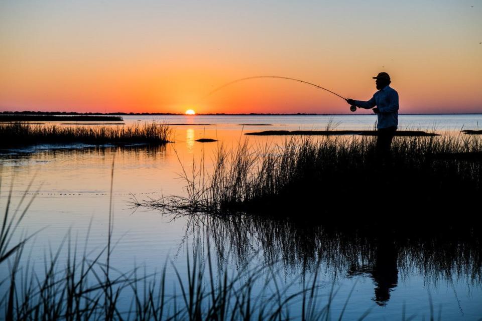 An angler drops a line at Powderhorn Ranch, which was recently donated to the state of Texas and will one day become a state park.