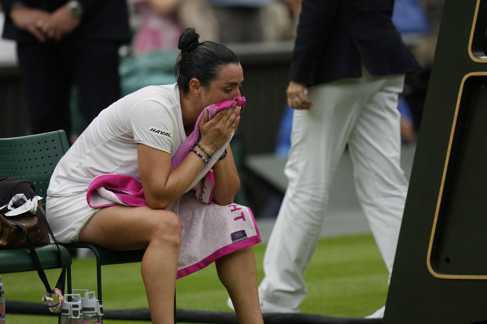 Tunisia's Ons Jabeur looks dejected after losing to Czech Republic's Marketa Vondrousova in the women's singles final on day thirteen of the Wimbledon tennis championships in London, Saturday, July 15, 2023. (AP Photo/Alastair Grant)