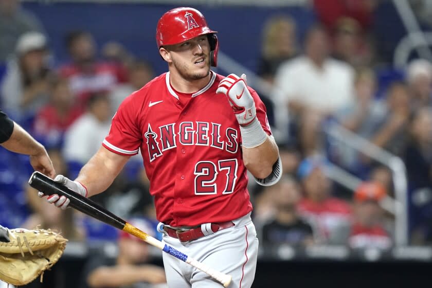 Los Angeles Angels' Mike Trout reacts after he struck out swinging during the fourth inning of the team's baseball game against the Miami Marlins, Tuesday, July 5, 2022, in Miami. (AP Photo/Lynne Sladky)