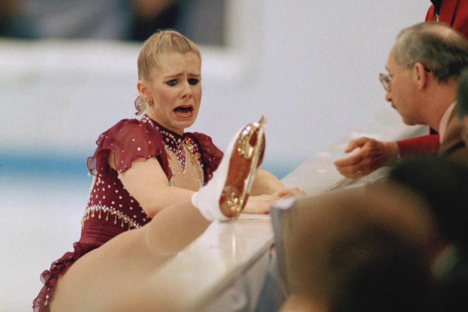 FILE - USA's Tonya Harding, of Portland, Ore., shows her skate to the judges after interrupting her free skating program at the Winter Olympics in Hamar, Norway on Feb. 25, 1994. Jack Smith, an AP photographer who captured unforgettable shots of the eruption of Mount St. Helens, the Exxon-Valdez oil spill, the Olympics and many other events during his 35-year career with the news organization, passed away on Jan. 4, 2023, at his home in La Mesa, Calif. He was 80. (AP Photo/Jack Smith, File)