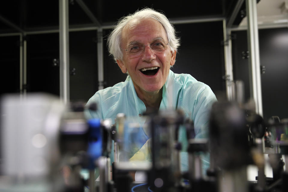 French scientist Gerard Mourou poses in his laboratory at the Ecole Polytechnique in Palaiseau, south of Paris, Tuesday, Oct.2, 2018. Three scientists from the United States, Canada and France won the Nobel Prize in Physics on Tuesday for work with lasers described as revolutionary and bringing science fiction into reality. (AP Photo/Christophe Ena)