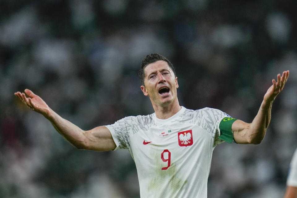 Poland's Robert Lewandowski celebrates scoring his side's 2nd goal during the World Cup group C soccer match between Poland and Saudi Arabia, at the Education City Stadium in Al Rayyan , Qatar, Saturday, Nov. 26, 2022. (AP Photo/Manu Fernandez)