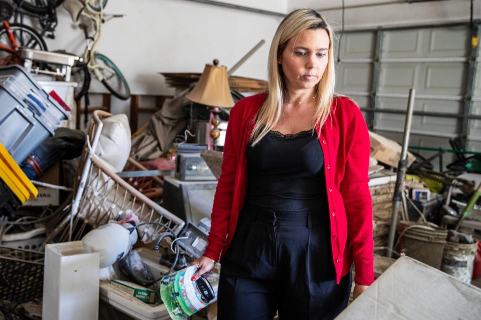 Dawn Elliot-Figueroa stands in the garage of her home in Cathedral City on Oct. 30.