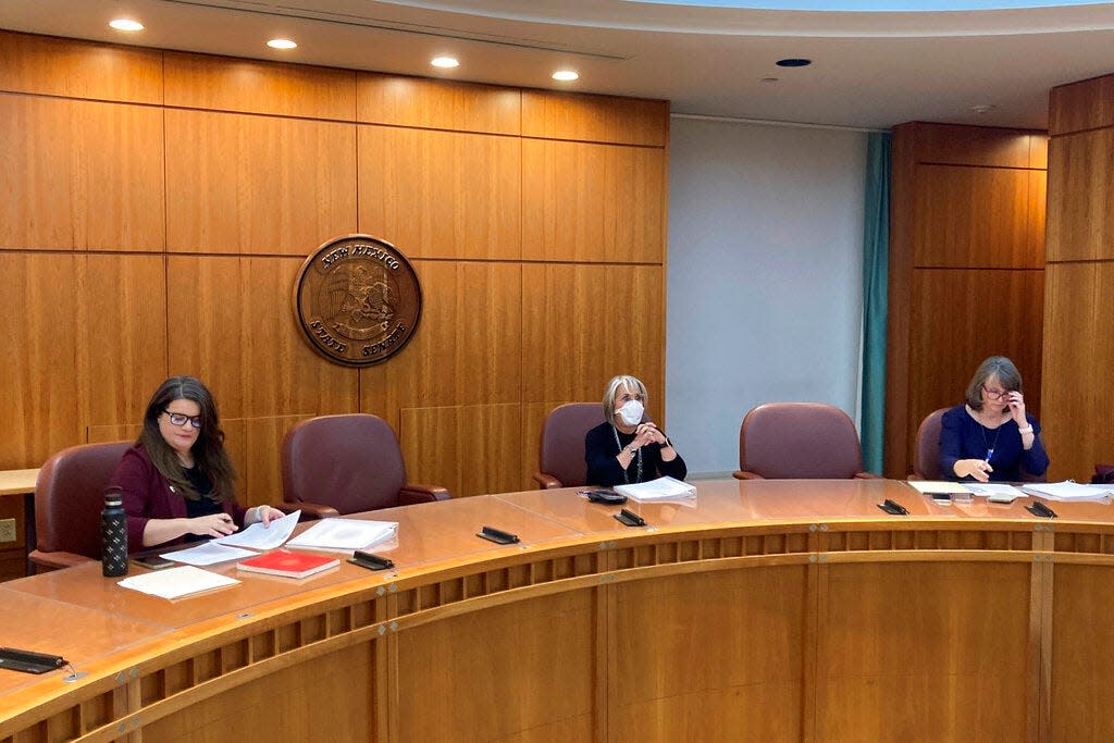 State Canvassing Board members certify results from the midterm election in New Mexico in a 3-0 vote amid praise for election administrators and poll workers, in Santa Fe, N.M., Tuesday, Nov. 29, 2022. The board includes, from left to right, Secretary of State Maggie Toulouse Oliver, Gov. Michelle Lujan Grisham and state Supreme Court Chief Justice Shannon Bacon.