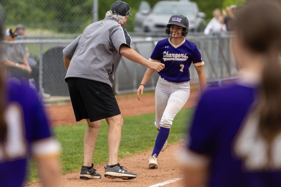 Leann Walzer (7) rounds third base after hitting a two-run home run in the bottom of the 4th inning during OLSH's first round matchup in the WPIAL Class 2A playoffs against Steel Valley Tuesday afternoon at North Allegheny High School.