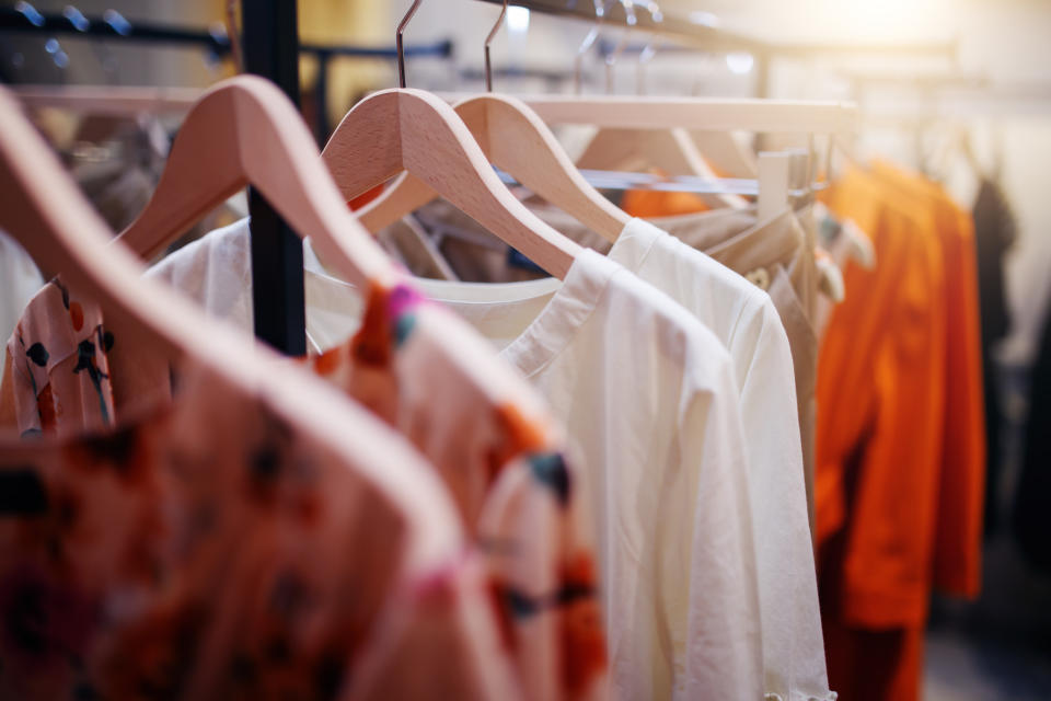 Clothing hanging on a rack.