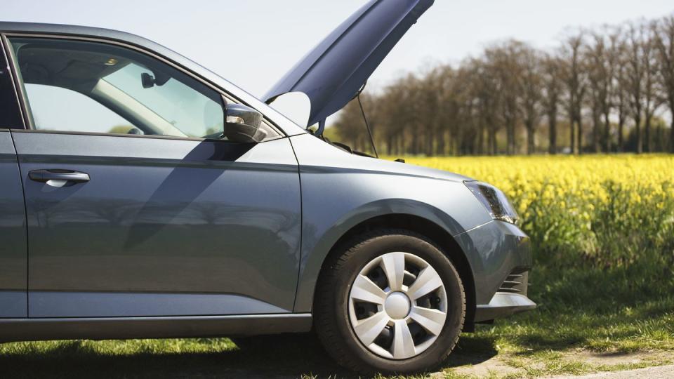 Cropped image of broken down car on roadside