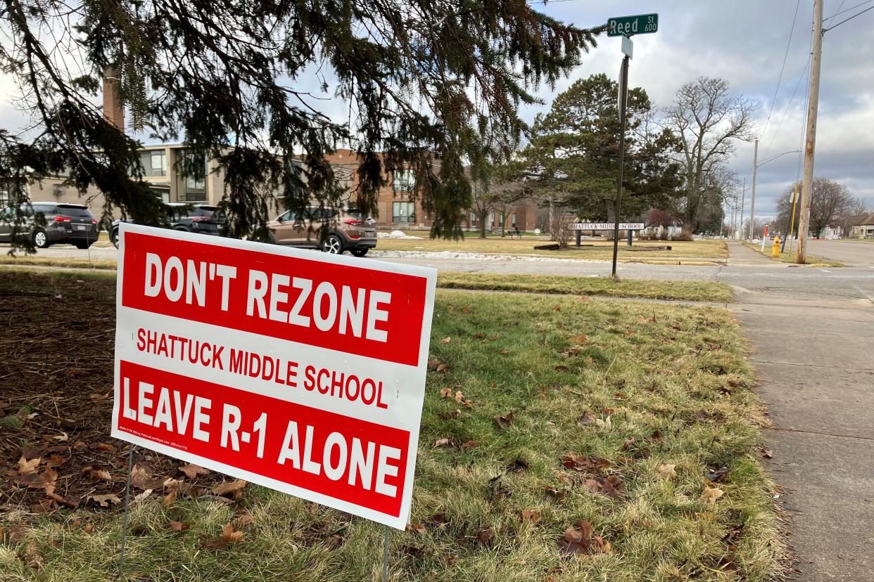 Signs opposed to rezoning Shattuck Middle School have remained more than a month after the Common Council rejected the rezoning.