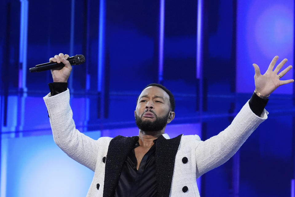 John Legend performs during the Democratic National Convention Wednesday, Aug. 21, 2024, in Chicago. (AP Photo/Brynn Anderson)