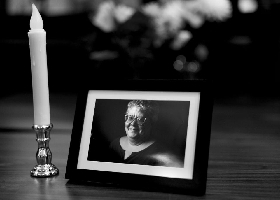 A photo of Lisa Trottier is displayed during her memorial service at The INN Between in Salt Lake City on Tuesday, Jan. 17, 2023. When a resident dies, residents and staff gather to remember them. There’s also a memorial rock garden across the parking lot from the building. | Laura Seitz, Deseret News
