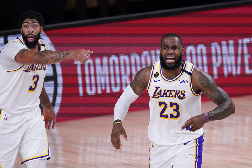 Los Angeles Lakers' LeBron James, right, and Anthony Davis are in position to win an NBA title together. (AP Photo/Mark J. Terrill)