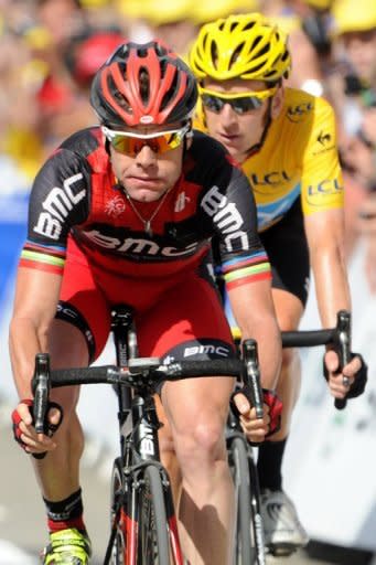 Australia's Cadel Evans (L) and Britain's Bradley Wiggins (R) rides to the finish line at the end of the eighth stage of the Tour de France starting in Belfort and finishing in Porrentruy on July 8. The pair are likely to leave many of those same rivals further in their wake after Monday's 41.5 km time trial in Besancon, one of two long time trials this year