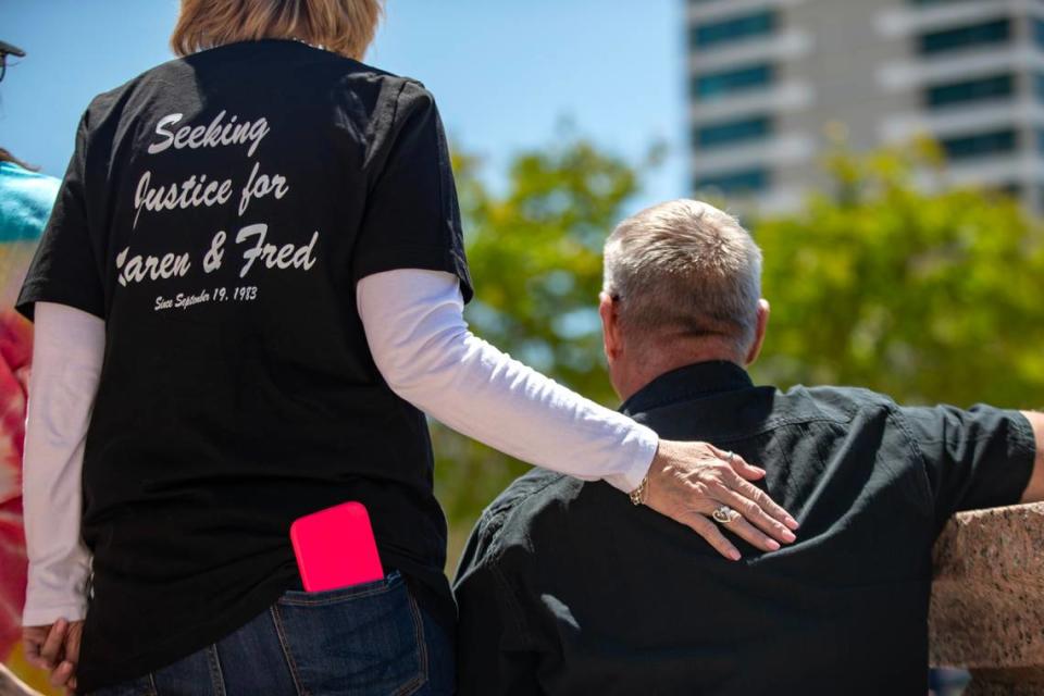 Family members comfort one another during a moment of prayer at the Tarrant County Courthouse in Fort Worth on Saturday, April 29, 2023. Dozens of people impacted by cold cases gathered to remember their loved ones and call for action to settle unsolved murders, disappearances and crimes.