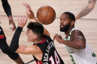 Miami Heat's Tyler Herro (14) looses the ball as Boston Celtics' Brad Wanamaker (9) closes in during the first half of an NBA conference final playoff basketball game Sunday, Sept. 27, 2020, in Lake Buena Vista, Fla. (AP Photo/Mark J. Terrill)