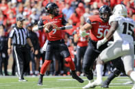 Cincinnati quarterback Desmond Ridder (9) throws a pass for a touchdown during the first half of an NCAA college football game against UCF, Saturday, Oct. 16, 2021, in Cincinnati. (AP Photo/Aaron Doster)