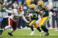 Green Bay Packers' Aaron Jones runs during the second half of an NFL football game against the Washington Redskins Sunday, Dec. 8, 2019, in Green Bay, Wis. (AP Photo/Matt Ludtke)